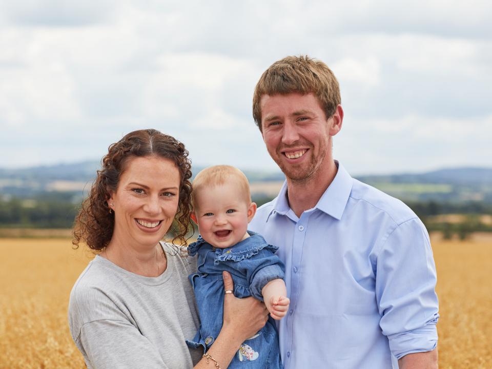 Family with grain field background